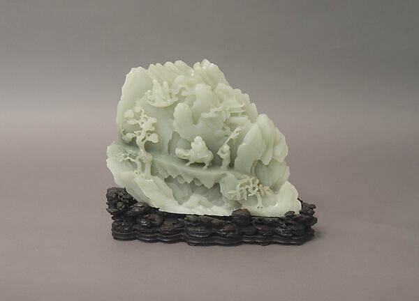 Eighteenth-century jade carving of Laozi crossing the Han Pass on his ox, illustrating the legend of his departure.