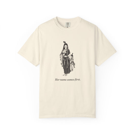 Radha · “Her name comes first.” — Garment-Dyed One-Ink Tee