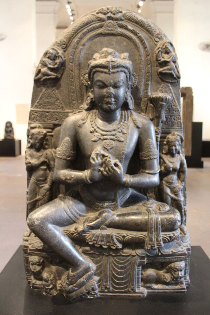 10th-century basalt Manjushri from Bihar, Pala-period India, seated with hands in teaching gesture and attendants.