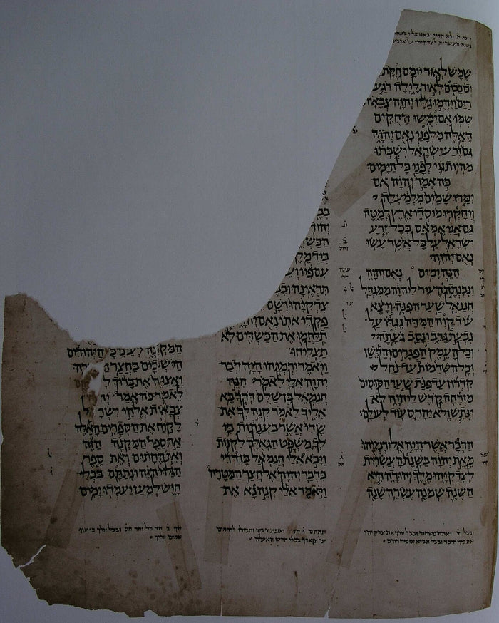 Surviving damaged Aleppo Codex leaf with repairs, showing the Masoretic Hebrew Bible text and its fragile transmission.