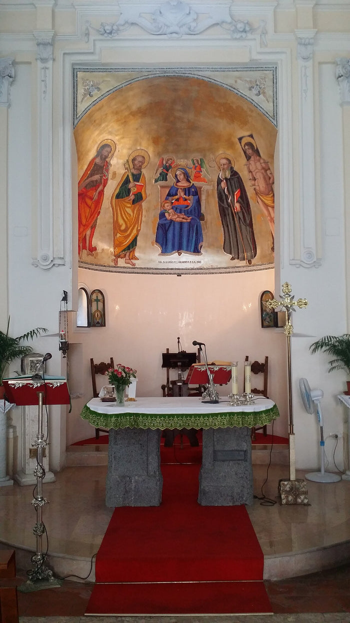Altar of the church of San Benedetto da Norcia in Angri, with a fresco showing Benedict beside the Madonna.