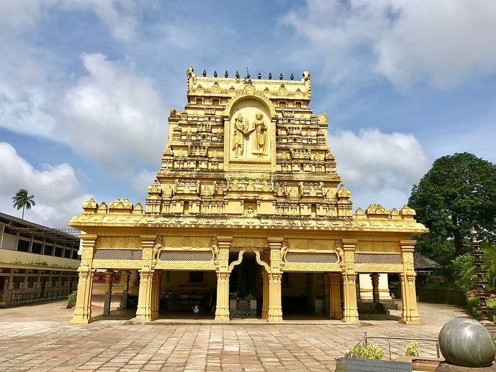 Annapurna Devi Hindu temple at Mudbidri, Karnataka, India: a temple gateway tower with a sculpted central niche.