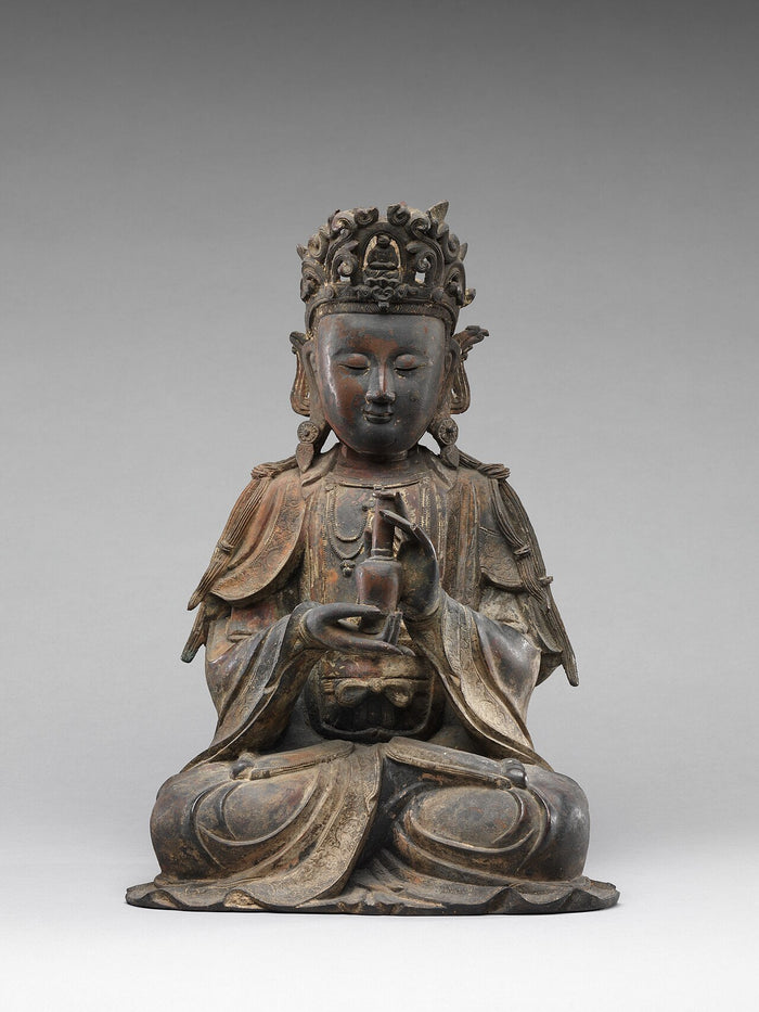 Seated Ming-dynasty Guanyin, 15th–16th century, wearing a crown with a small Buddha and holding a vase.