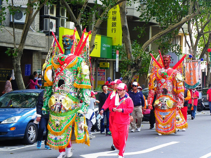 Costumed Qianliyan and Shunfeng'er generals walking in the 2013 Ciyou Temple Mazu cruise parade, Taiwan.