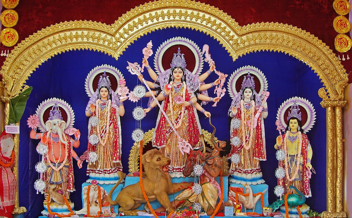 Durga with lion, defeated Mahishasura and her children Ganesha, Lakshmi, Saraswati and Kartikeya, in the family tableau; Burdwan, 2011.