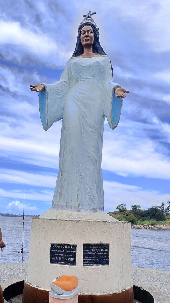 Monument to Iemanjá in Espírito Santo, Brazil, with open arms, crown and plaques honouring Afro-Brazilian traditions.
