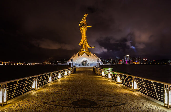 Gilded Kun Iam statue and shrine on a pier in Macau, a modern site devoted to Guanyin.
