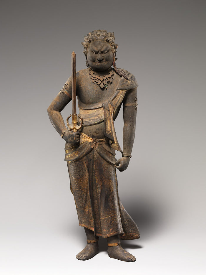 Standing wooden Fudō Myōō holding the sword, with curly hair and gilt-patterned skirt, showing a different sculptural pose.