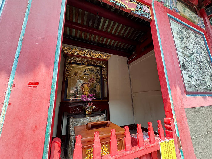 Entrance to the Hall of Yue Lao at Longshan Temple, with the shrine seen inside and red-lacquered railings outside.