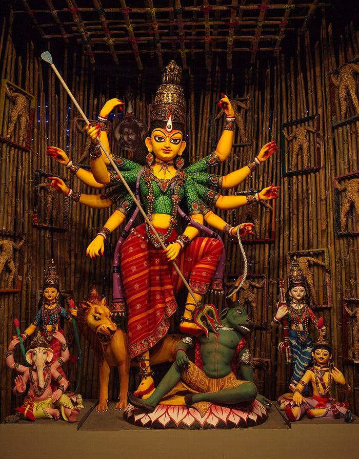 Ten-armed Durga with trident, lion and Mahishasura, flanked by Ganesha and other deities; Haridevpur Athletic Club Durga Puja, 2019.