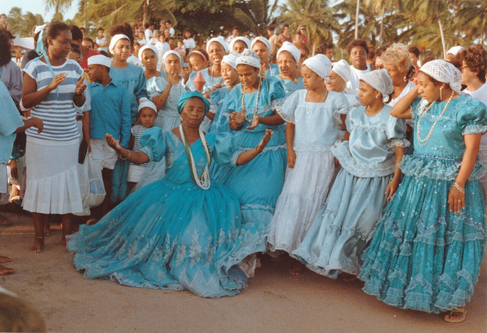 Devotees in blue and white dresses at a 1992 homage to Iemanjá in Maceió, Brazil, showing Candomblé dress and devotion.