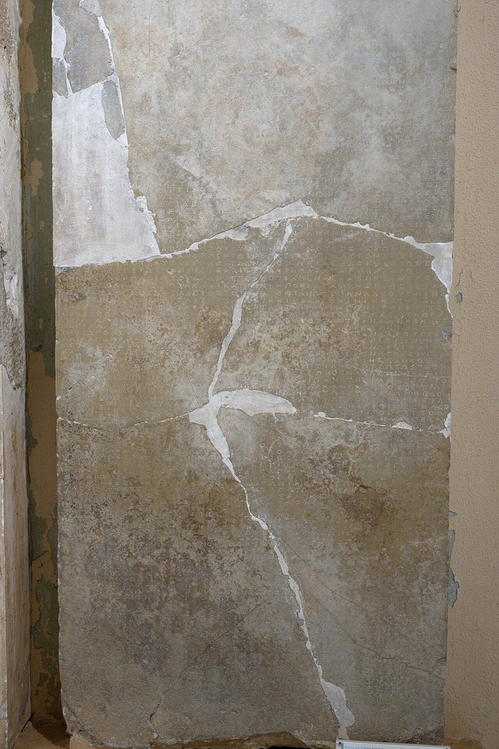 Epidaurus stele inscribed with miraculous cures attributed to Asklepios, evidence of his healing cult.
