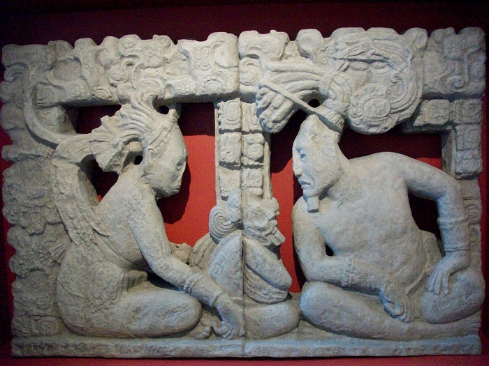 Sculpture of Itzamna and Ixchel seated facing each other, showing the creator god alongside his consort (2011 photo).