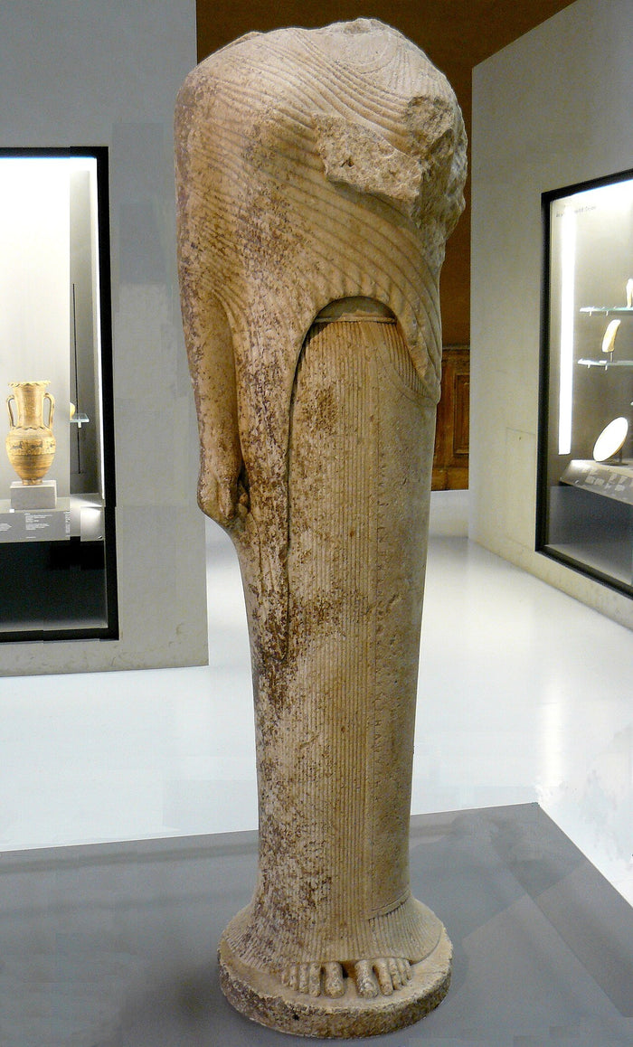Archaic Koré from Samos, shown in a long pleated robe, linked to Hera's major cult on Samos.