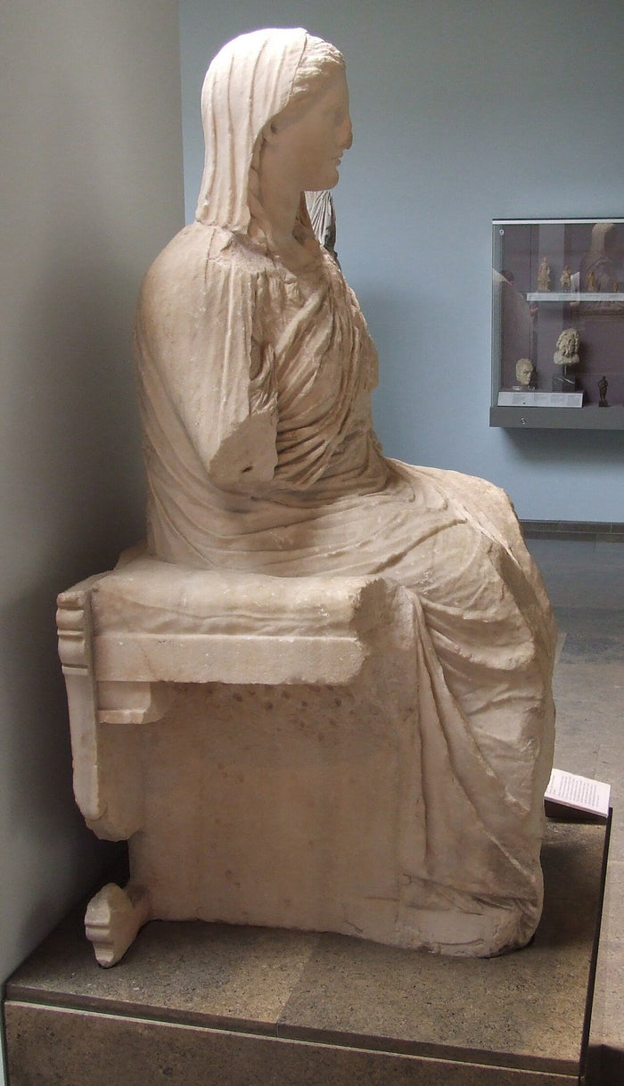 Seated, veiled marble Demeter from Knidos, British Museum, showing her as a dignified matron goddess.