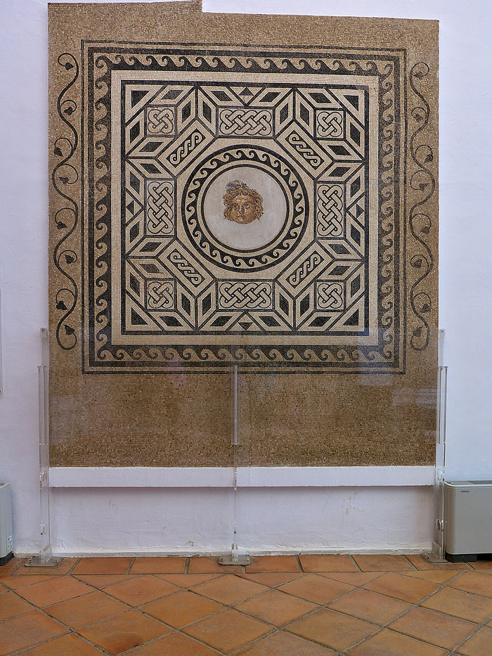 Roman mosaic from Córdoba with a central Medusa head in a geometric frame, showing the gorgoneion in Roman decoration.