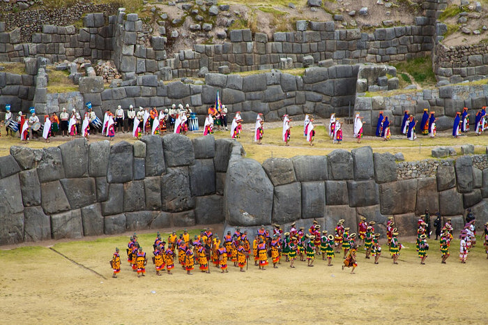 Inti Raymi solstice festival, 2012: costumed participants perform before the megalithic walls of Sacsayhuamán near Cusco, a ritual site of Inti.