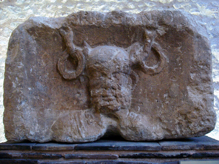 Gallo-Roman relief from the Pilier des Nautes, Paris: bearded head with antlers bearing rings, inscribed Cernunnos.