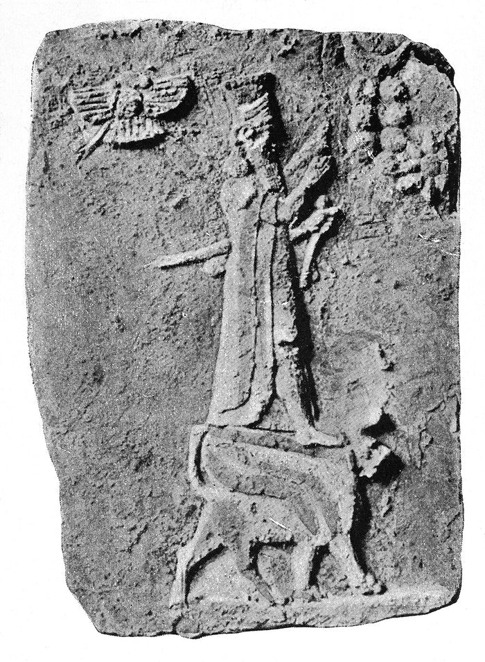 Relief of Marduk standing on his sacred animal, with a winged-disc symbol above, showing his traditional iconography.