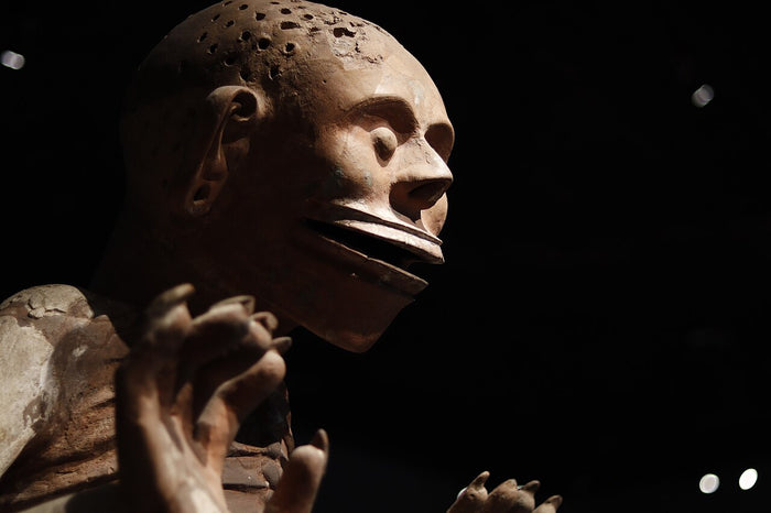 Face of the Templo Mayor Mictlantecuhtli sculpture, with a perforated scalp that once held hair and a fanged, open mouth.