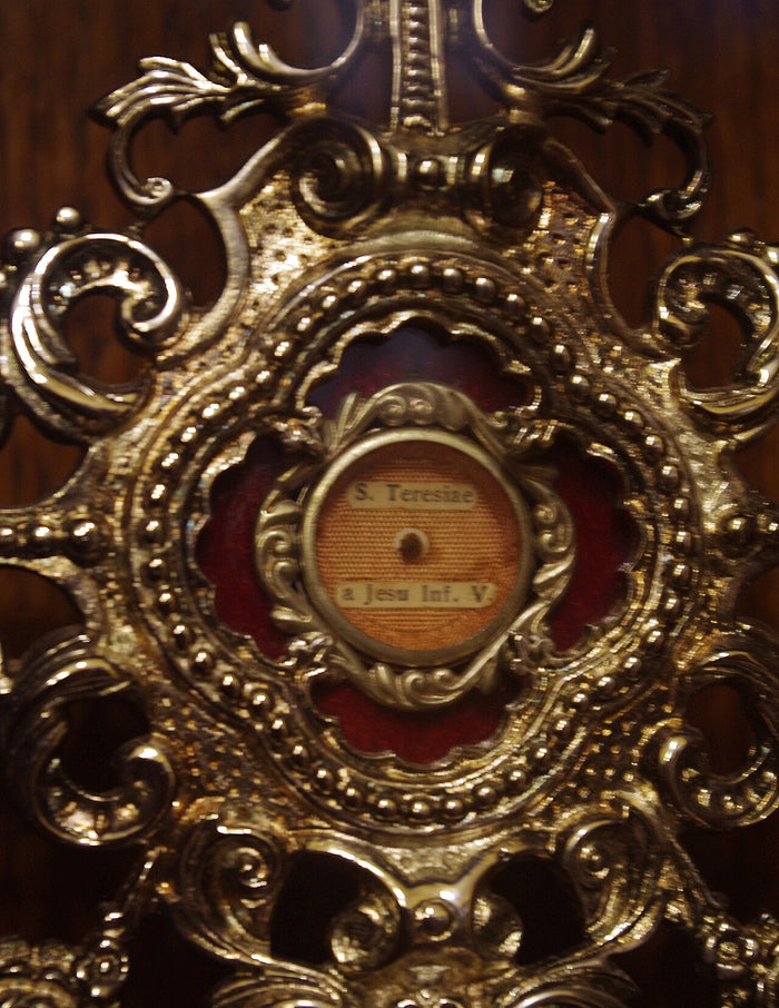 Reliquary at Saint Patrick Church, Columbus, inscribed for Thérèse of the Child Jesus, showing veneration of her relics.