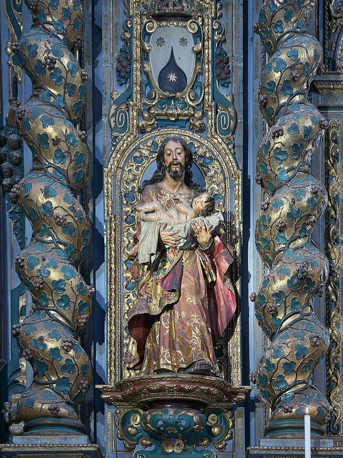 Polychrome sculpture of San José carrying the Christ Child on a gilded altarpiece, Convento de Santa Ana, Seville.