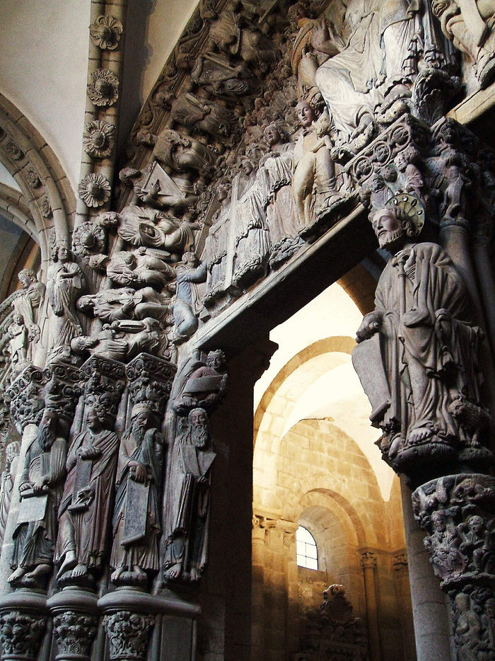 Pórtico de la Gloria in Santiago de Compostela, with the haloed seated figure of St James on the central pillar.