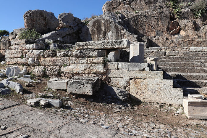Temple of Hekate and exedra beside the processional way at Eleusis, linking her to the Eleusinian Mysteries.