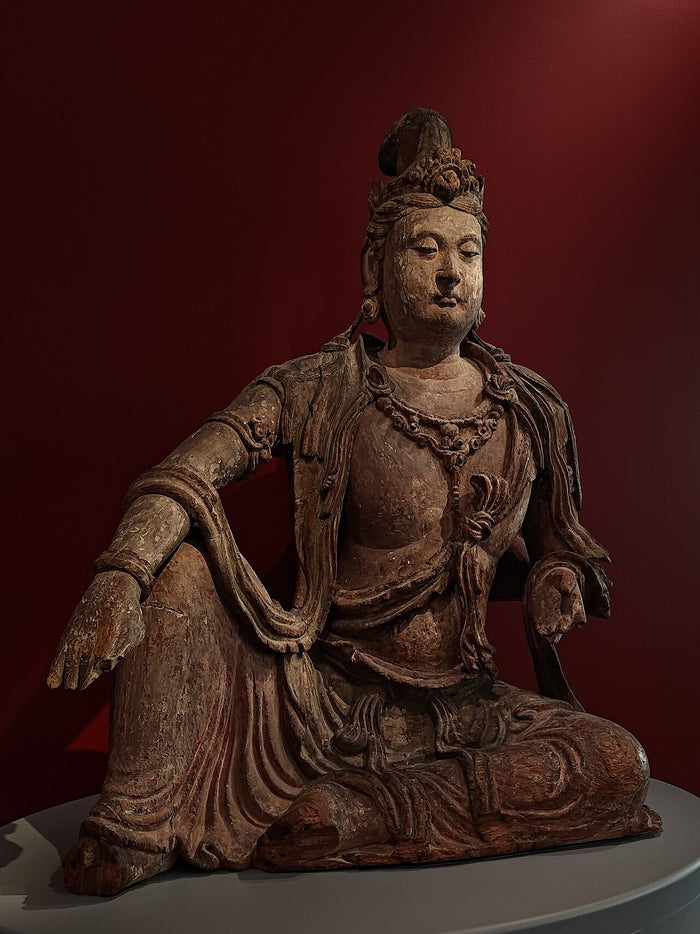Painted wooden Water-Moon Guanyin in the relaxed royal-ease pose, a favourite Chinese iconographic type of the Song–Jin period.