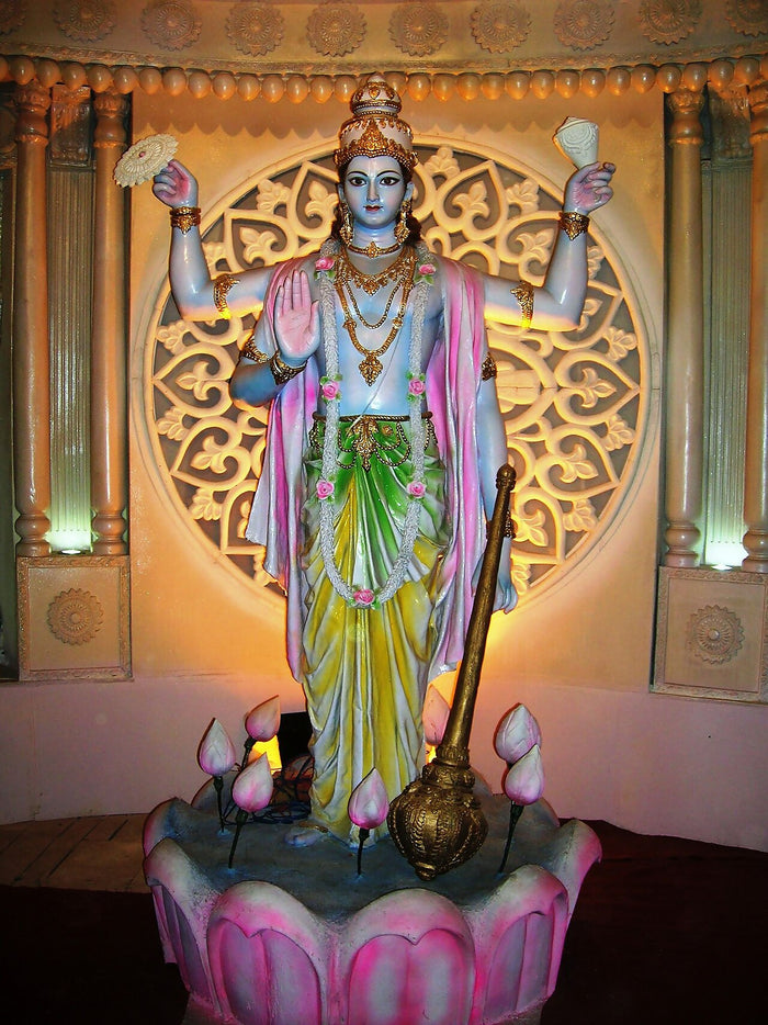 Standing four-armed Vishnu with conch, discus, mace and lotus at a Kumartuli Park Durga Puja pandal, Kolkata, 2010.