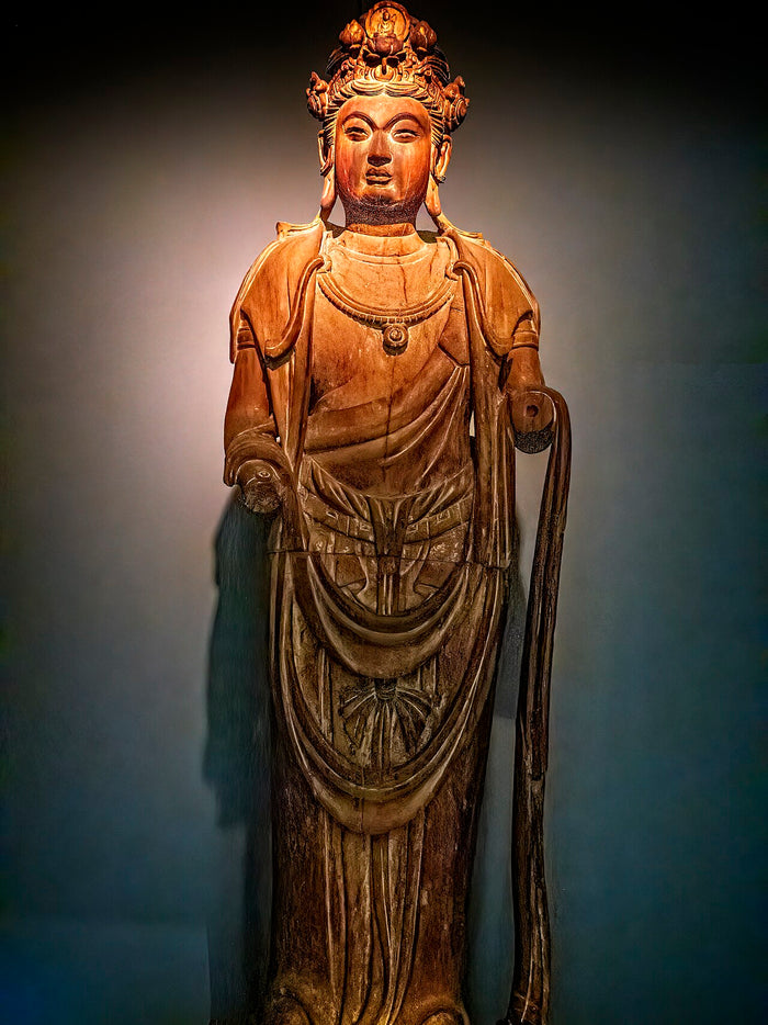 Standing wooden Guanyin from the Song dynasty (960–1279), with an ornate crown and flowing garments.