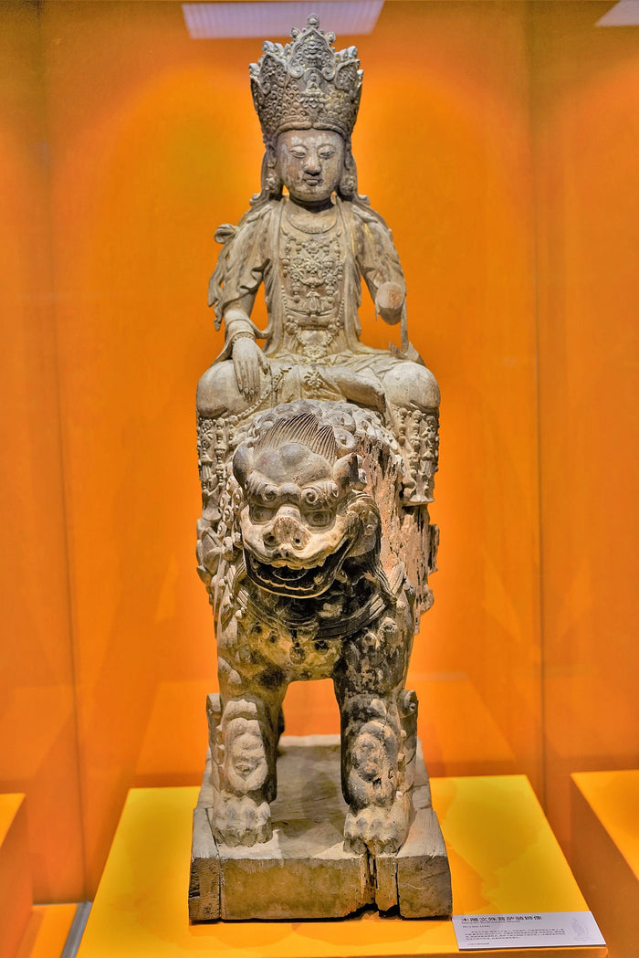 Carved wooden Wenshu riding a lion, Chinese Buddhist sculpture where he is paired with Samantabhadra on an elephant.