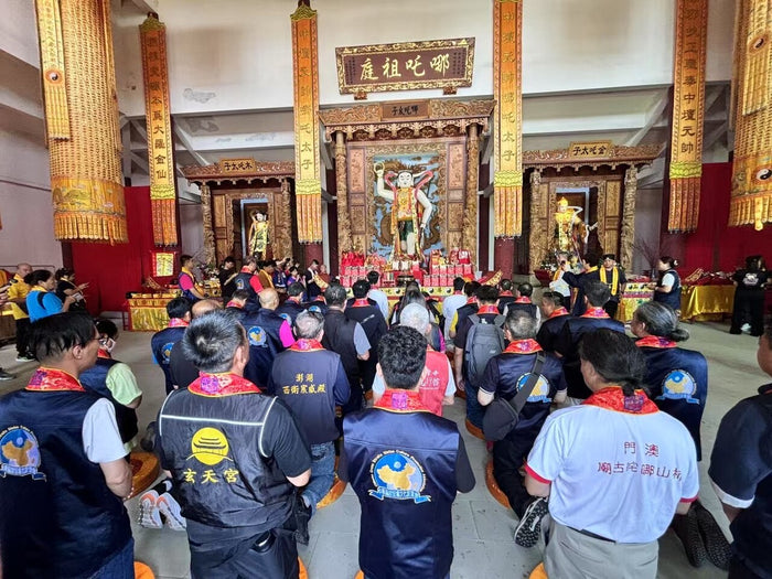 Main shrine hall of the Nezha ancestral temple at Cuiping Mountain, Jiangyou, with worshippers before the central Nezha altar.