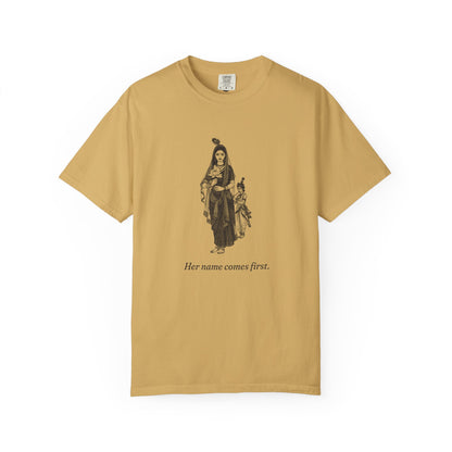 Radha · “Her name comes first.” — Garment-Dyed One-Ink Tee