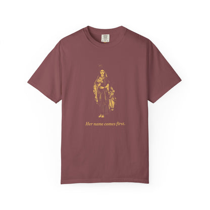 Radha · “Her name comes first.” — Garment-Dyed One-Ink Tee