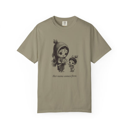 Radha · “Her name comes first.” — Garment-Dyed One-Ink Tee