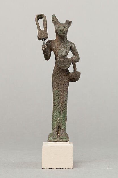 Bronze Bastet holding a sistrum, an aegis and a basket, Egypt, 664–30 BCE.