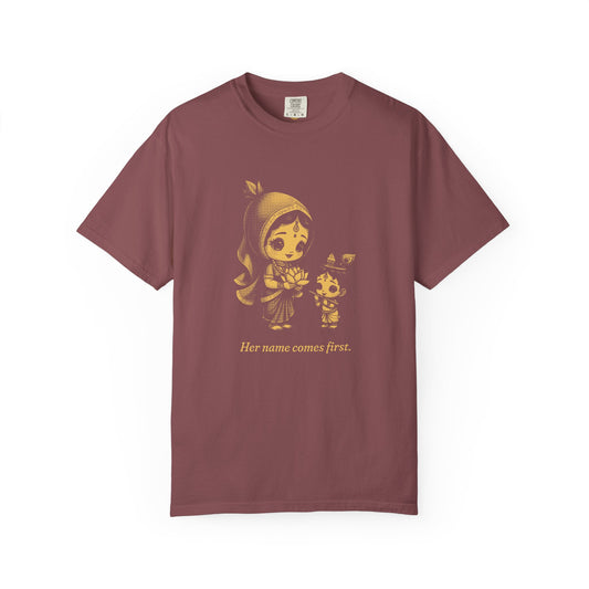 Radha · “Her name comes first.” — Garment-Dyed One-Ink Tee