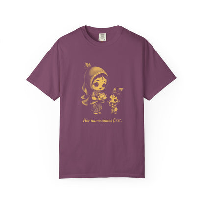 Radha · “Her name comes first.” — Garment-Dyed One-Ink Tee