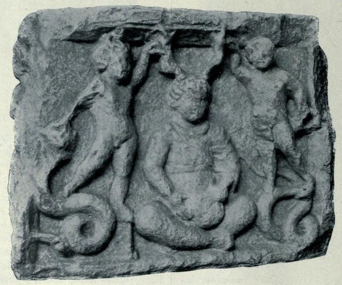 Stele from Vendœuvres (Indre): seated Cernunnos flanked by two figures with serpentine tails, shown in a 1907 photograph.