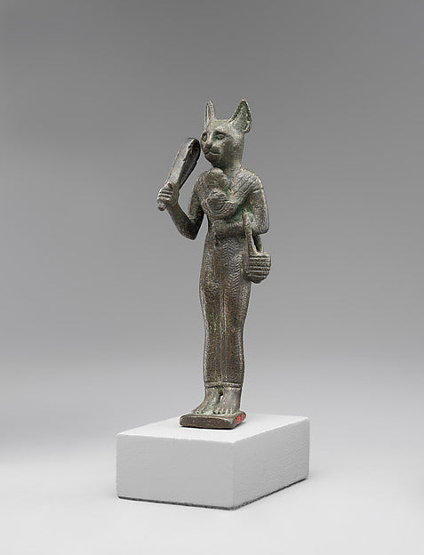Bronze statuette of cat-headed Bastet with a sistrum, an aegis and a basket, Late Period Egypt.