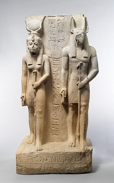 Statue of Wepwawet beside Isis-Hathor, who wears the cow-horn and sun-disk crown, about 1290–1224 BCE.