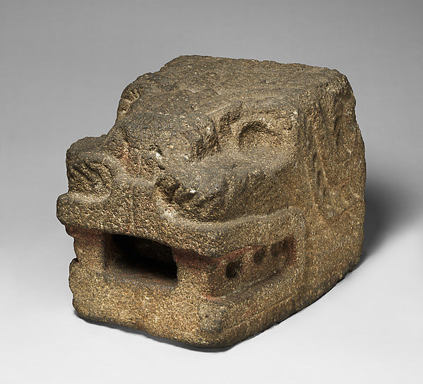 Feathered serpent head from Teotihuacan, 100–500 CE, an early stone image of the deity.