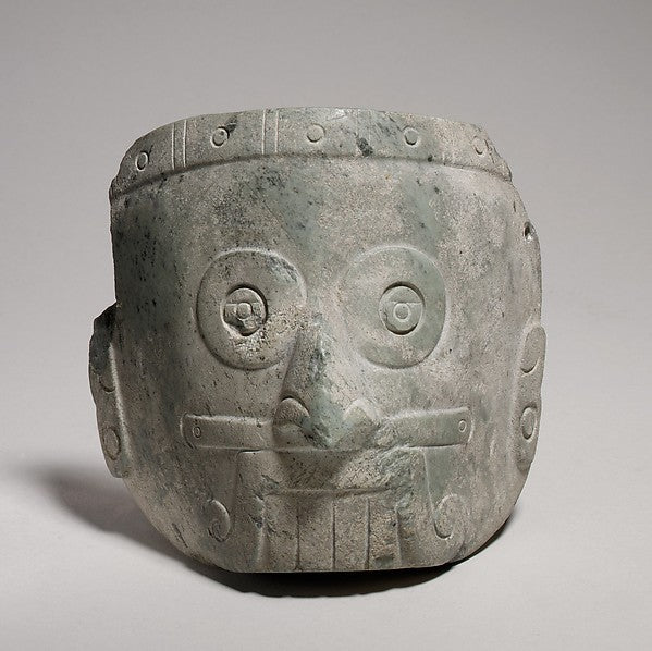 Mixtec rain god mask (1325–1521 CE), with goggle eyes and a mouth band; shows the deity's regional counterpart, Dzahui.