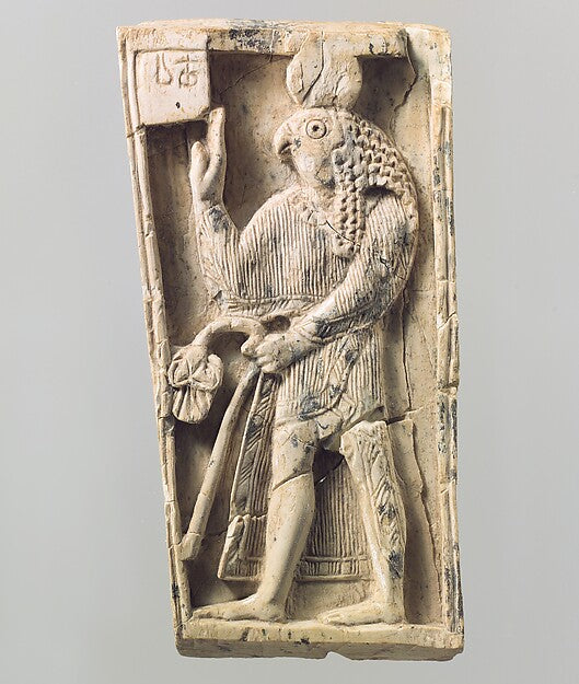 Assyrian ivory plaque of a falcon-headed figure with sun disc, showing Egyptian Ra imagery spreading abroad, 9th–8th century BCE.