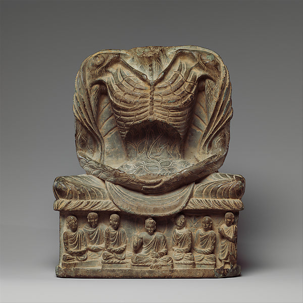 Fasting Buddha Shakyamuni, 3rd–5th century Gandhara (Pakistan), showing his extreme asceticism before enlightenment, with monks carved on the base.
