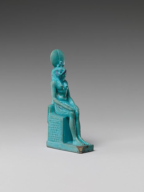 Faience statuette of Re-Harakhty, seated with falcon head and sun disc, Ptolemaic period (332–30 BCE).