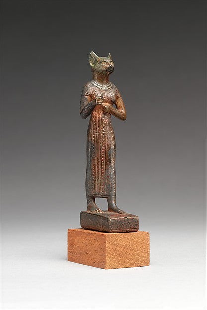Bronze statuette of cat-headed Bastet in a long dress, Egypt, 664–30 BCE.