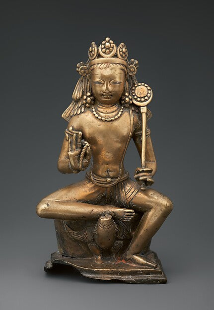 Eighth-century Kashmiri bronze of Karttikeya, god of war, holding a staff, with a peacock beneath.
