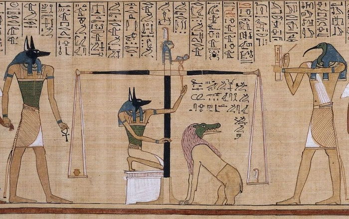 Jackal-headed Anubis steadies the scales in the weighing of the heart, Papyrus of Hunefer, c. 1275 BCE.